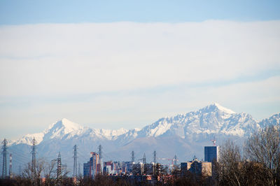 Panoramic view of cityscape against sky during winter