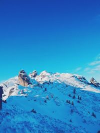 Scenic view of snow covered mountains