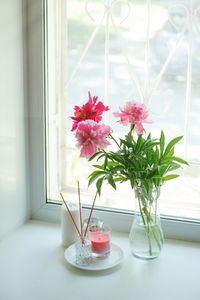 Close-up of pink flower vase on table