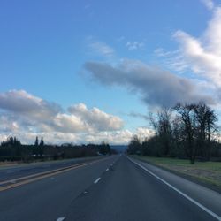 Empty road passing through landscape