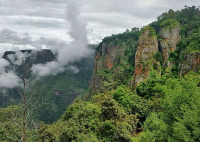 Scenic view of mountains against cloudy sky