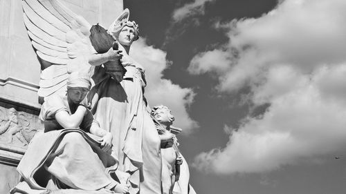 Low angle view of statue against sky