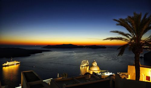 Scenic view of sea against clear sky at sunset