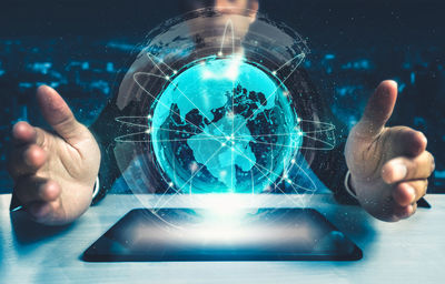 Close-up of hand touching glass