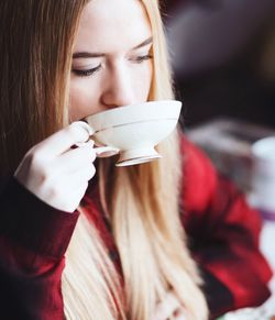 Young woman drinking tea