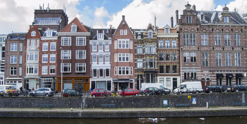 Houses against sky in city