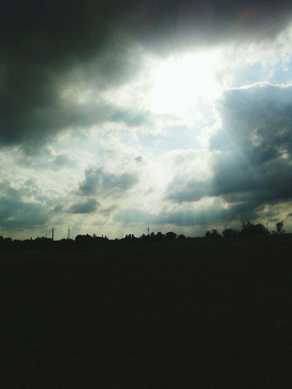 sky, silhouette, cloud - sky, cloudy, tranquil scene, scenics, tranquility, beauty in nature, landscape, nature, weather, cloud, overcast, dark, storm cloud, idyllic, dusk, outdoors, dramatic sky, sunset