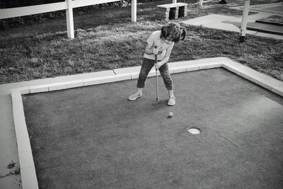 Full length of a man playing with ball