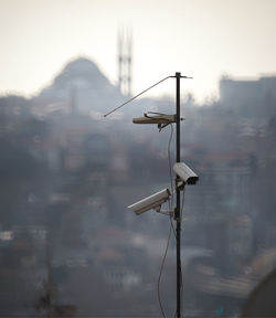 Low angle view of communications tower against sky