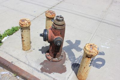 High angle view of fire hydrant on footpath