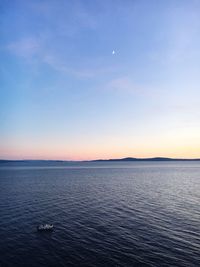 Scenic view of sea against clear sky during sunset