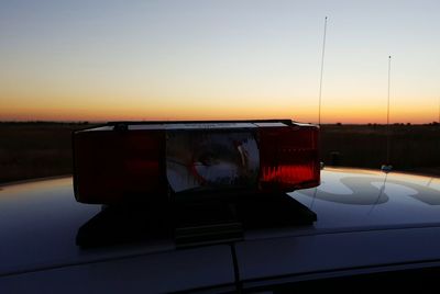 Car on road at sunset