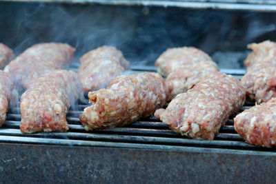 Close-up of meat on barbecue grill