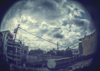 View of buildings against cloudy sky