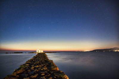 Scenic view of sea against sky at night