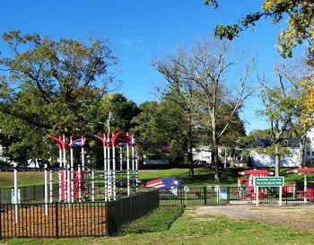 View of playground against trees in park