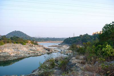 Scenic view of river against clear sky