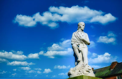 Low angle view of statue against sky