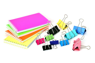 High angle view of multi colored pencils on white background