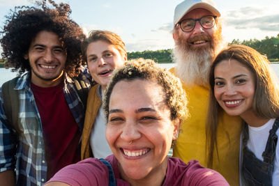 Wanderlust lifestyle, selfie, multiracial group of trendy people having fun together on vacation