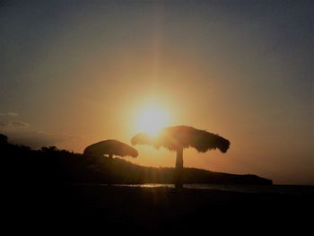 Scenic view of silhouette trees against sky during sunset