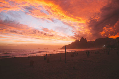 Scenic view of beach against sky during sunset