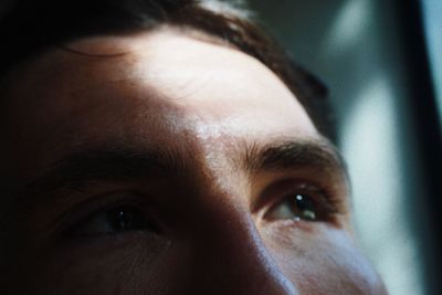 Close-up of thoughtful man looking away