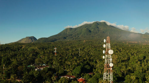 Scenic view of mountains against clear blue sky