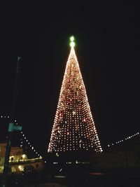 Low angle view of illuminated lights at night