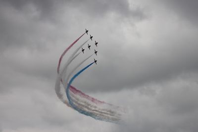 Low angle view of airshow in sky