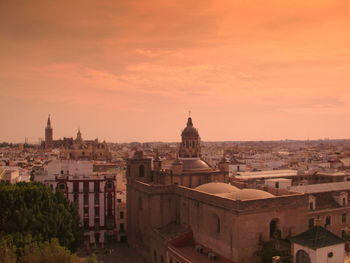 High angle view of buildings in city against sky during sunset. seville spain