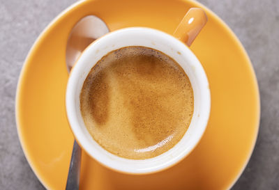 High angle view of coffee cup on table