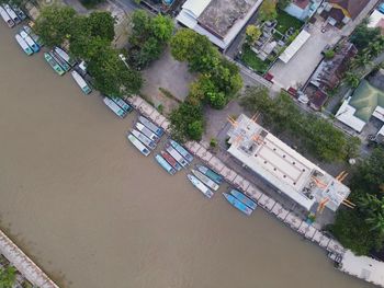 High angle view of buildings by river in city