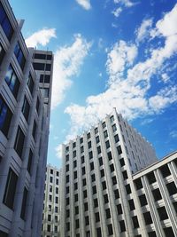 Low angle view of modern buildings against sky