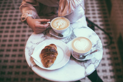 High angle view of coffee cup on table