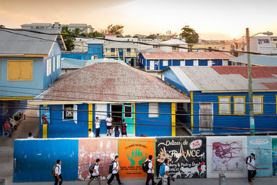 Group of people in front of buildings in city