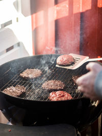 Man preparing food on barbecue grill