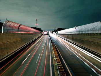 Light trails on highway in city at night