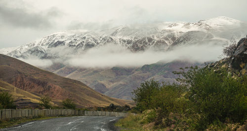 Scenic view of snowcapped mountains against sky