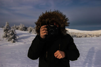 Man photographing with camera