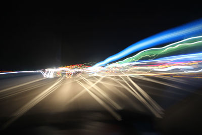 Light trails against sky at night