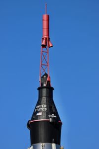 Low angle view of lighthouse against clear blue sky