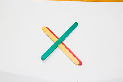 Close-up of colored pencils against white background