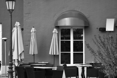 Empty chairs and tables at an outdoor restaurant