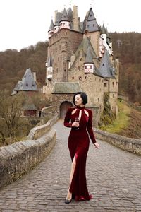 Portrait of woman standing against temple