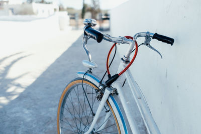 Low section of man riding bicycle on street