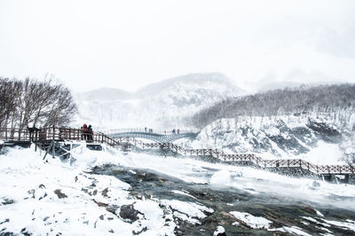 Scenic view of frozen lake against clear sky