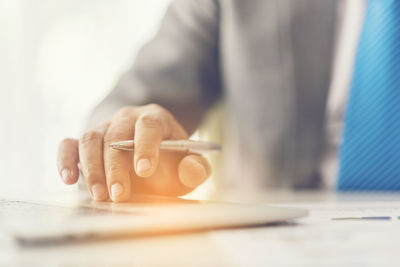 Close-up of man working on table