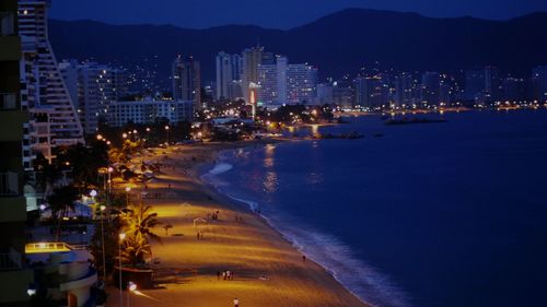 View of city lit up at night