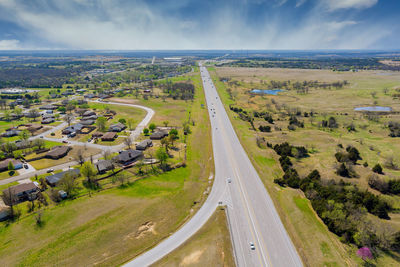 High angle view of road amidst landscape against sky